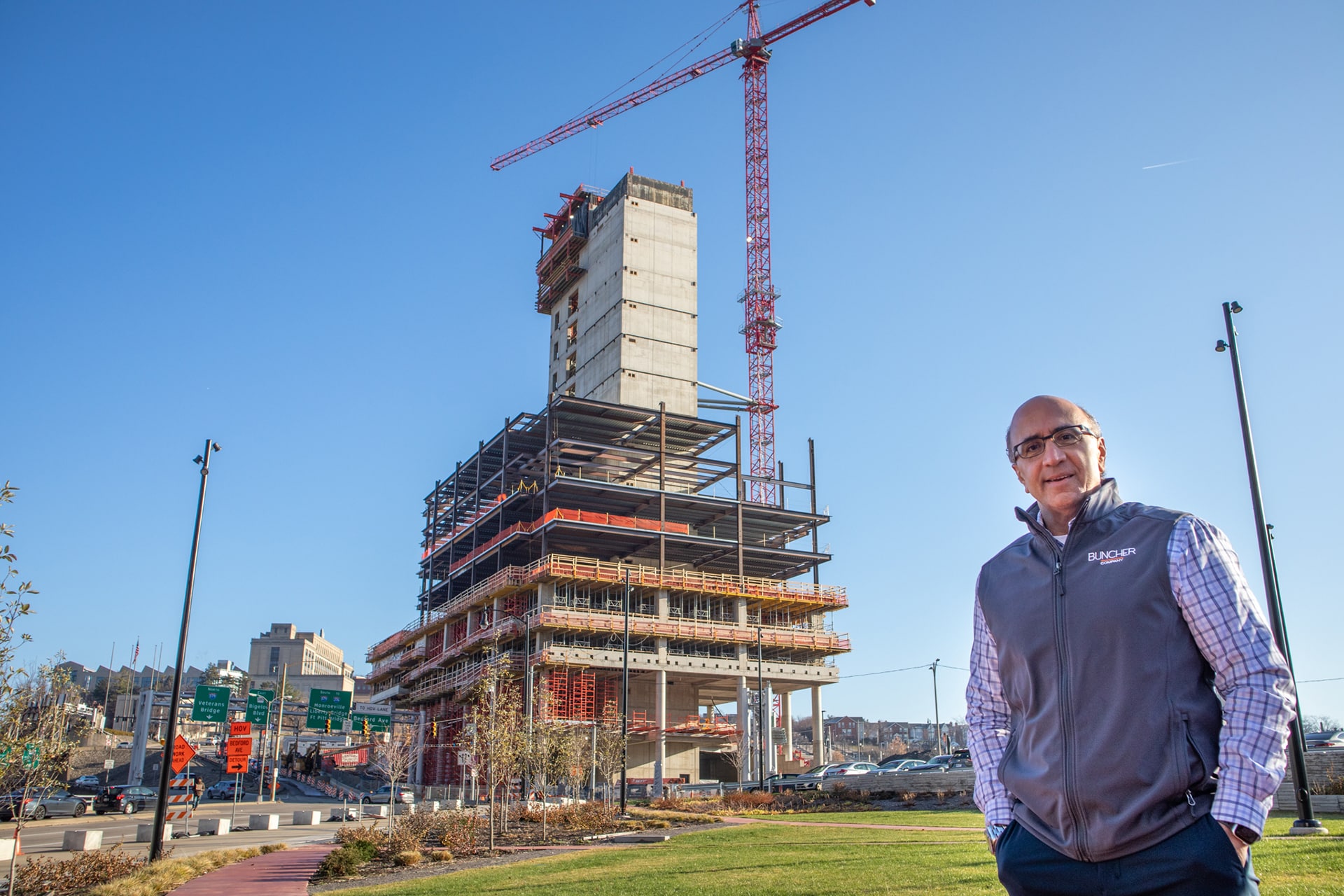 Gregg Broujos in front of the new FNB Tower that is under construction.